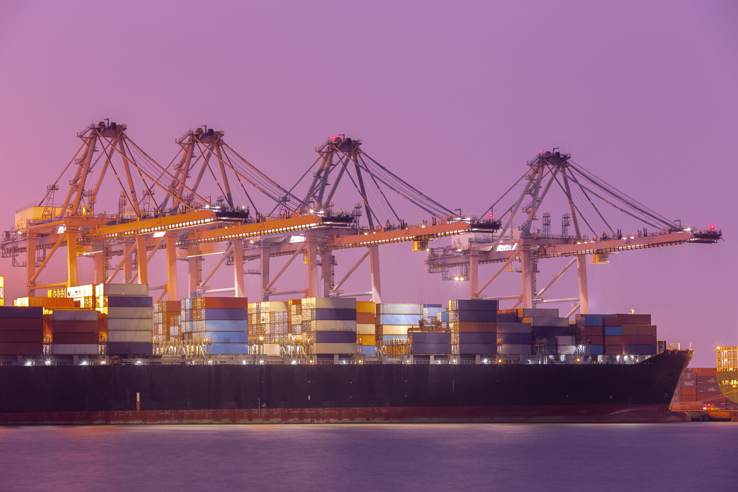 Cargo ship at harbor representing the student to exporter journey in global trade and logistics