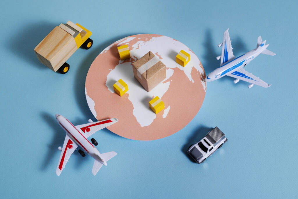 Supply chain still life for import-export training featuring transport and shipment models